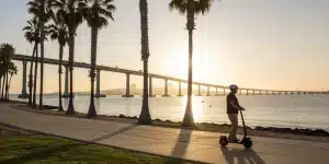 Coronado Island Segway tour at sunset with ocean and bridge view.