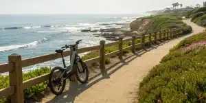 A rental e-bike on a scenic path overlooking the ocean near La Jolla Cove.