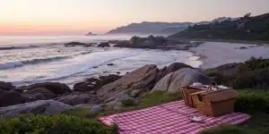 Romantic beach picnic at sunset in San Diego for a couples tour.