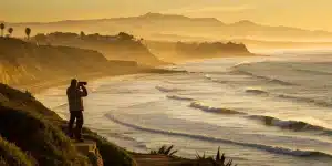 A private tour guide in San Diego overlooking the coast, a view that influences tour prices.